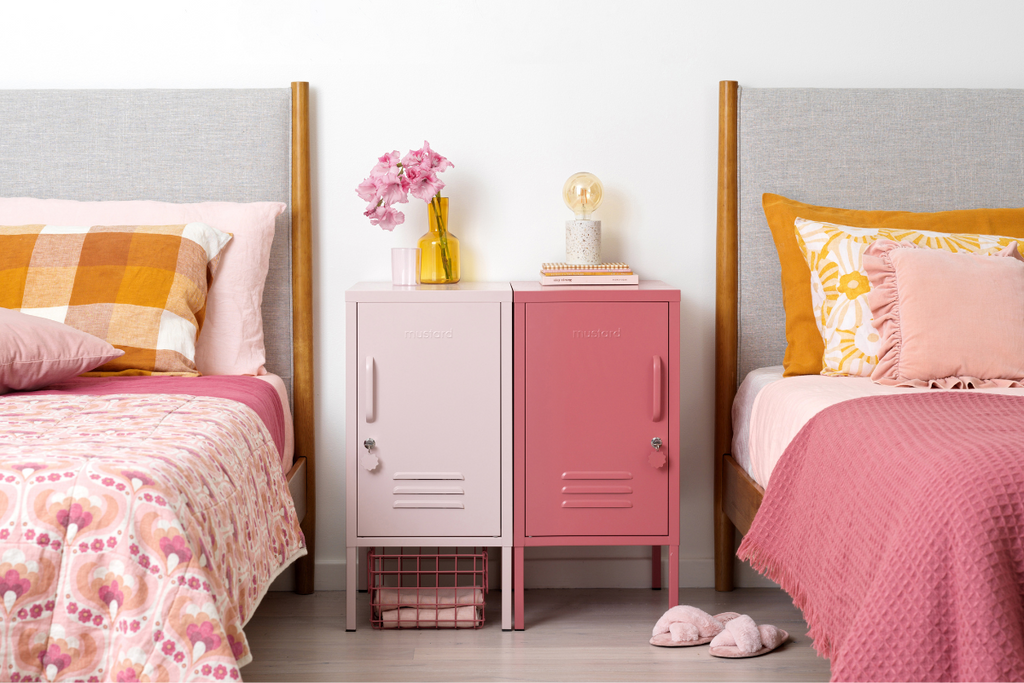 The Shorty in Blush and The Shorty to the Left in Berry side by side. There are beds with pink bedspreads on either side.